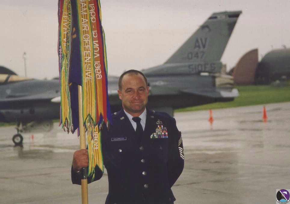 chief holdridge with squadron flag